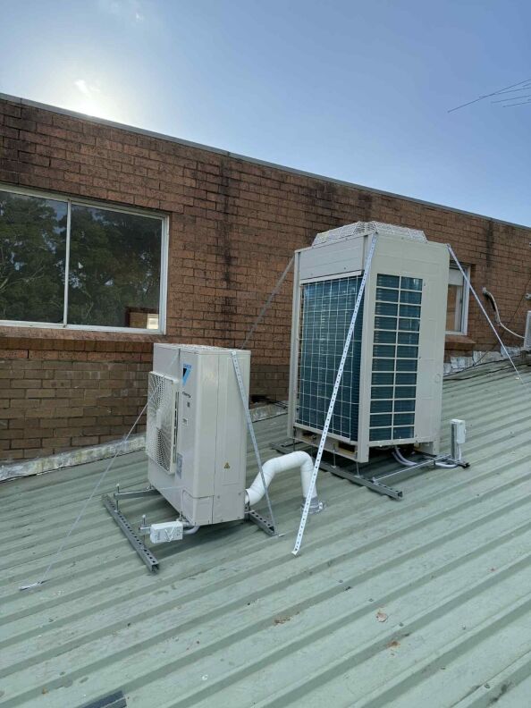Two air conditioning units installed on a rooftop in Sydney, showcasing expert installation by Jays Airconditioning Sydney.